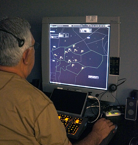 Image of air traffic controller participating in the human-in-the-loop simulation study on Ground Based Interval Management-Spacing (GIM-S) for NASA's Air Traffic Management Demonstration -1 (ATD-1)