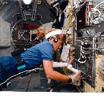 Image of a crew member working in an AFS-2 suit.