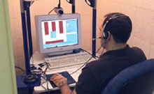 Image of a research subject playing a Decision-Making game during a DTDM study.